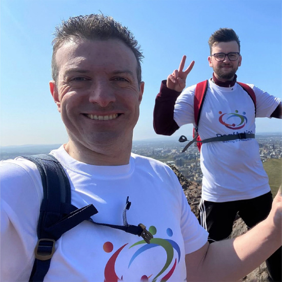 Deaf Action fundraisers walking a munro