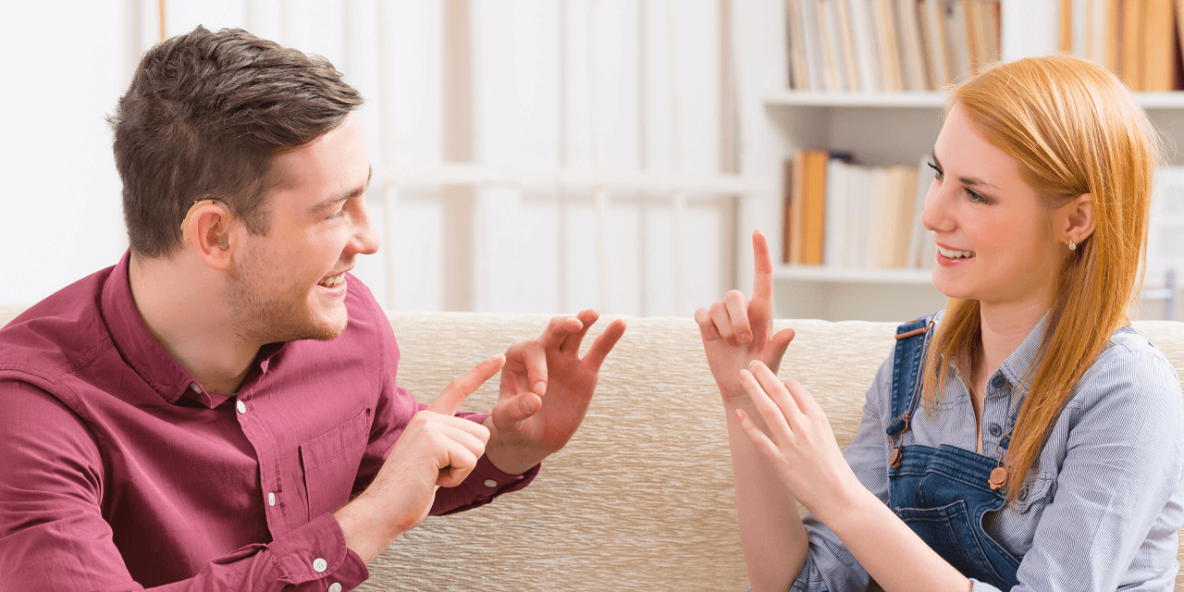 Man and woman using sign language