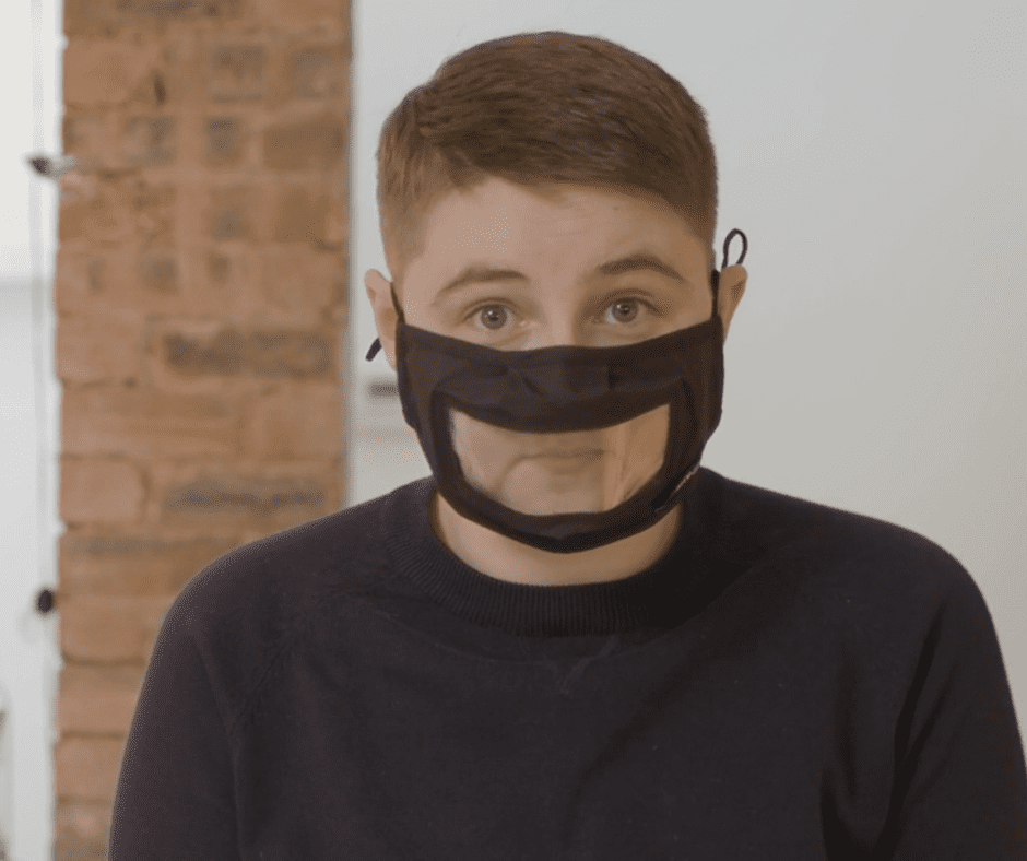 Boy wearing clear facemask